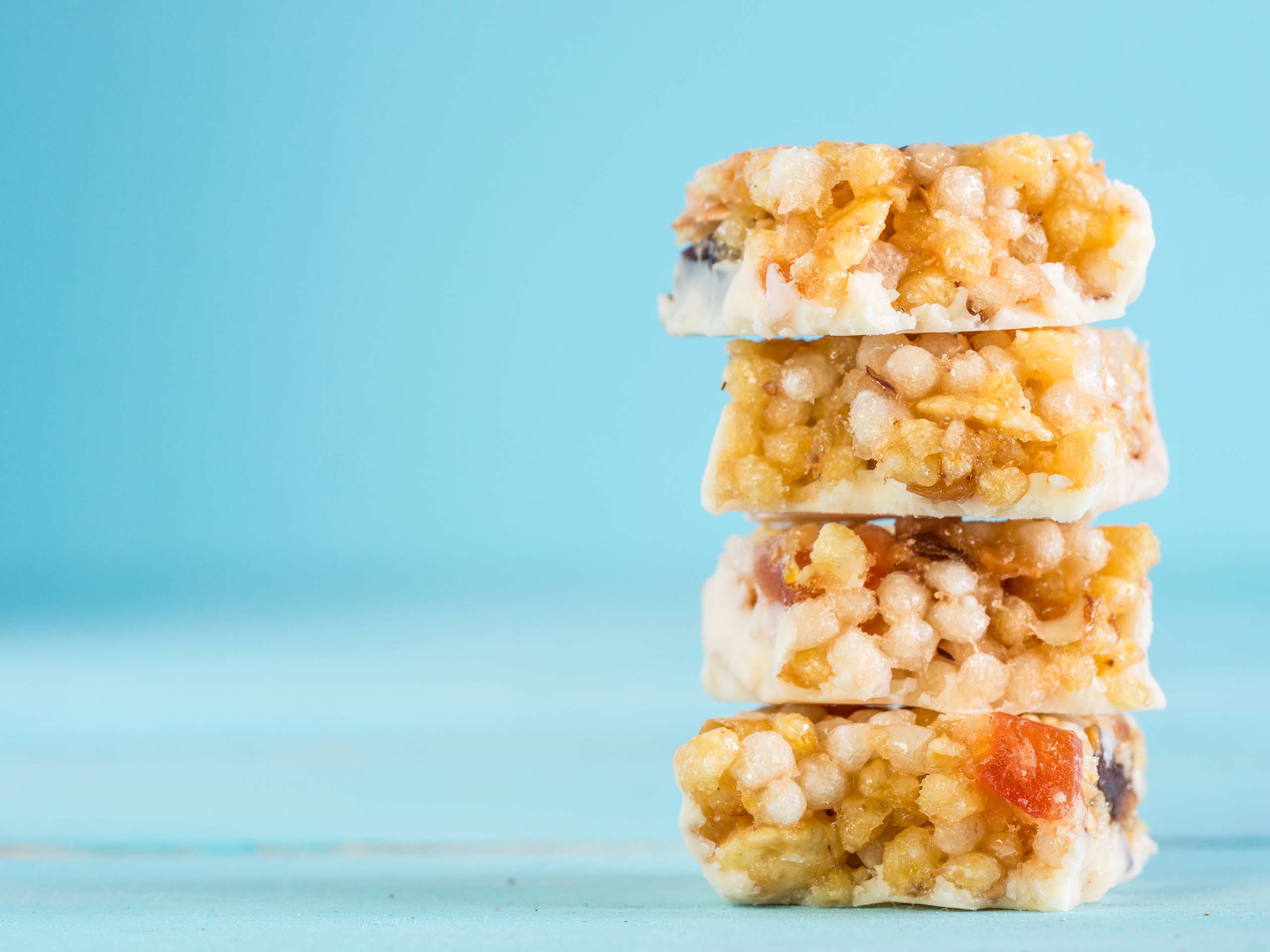 A stack of cereal bars on a blue background